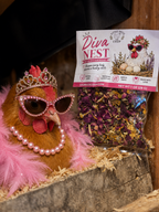 Diva chicken sitting in a nesting box with sunglasses, a pearl necklace and a tiara next to a 'Diva Nest' product packaging.